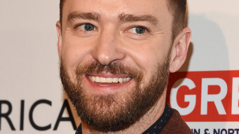 Justin Timberlake smiles with beard