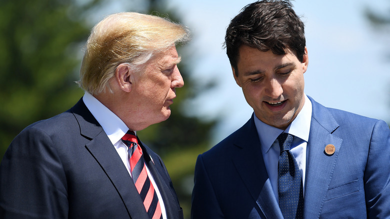 Donald Trump speaking to Justin Trudeau at the 2018 G7 meeting.