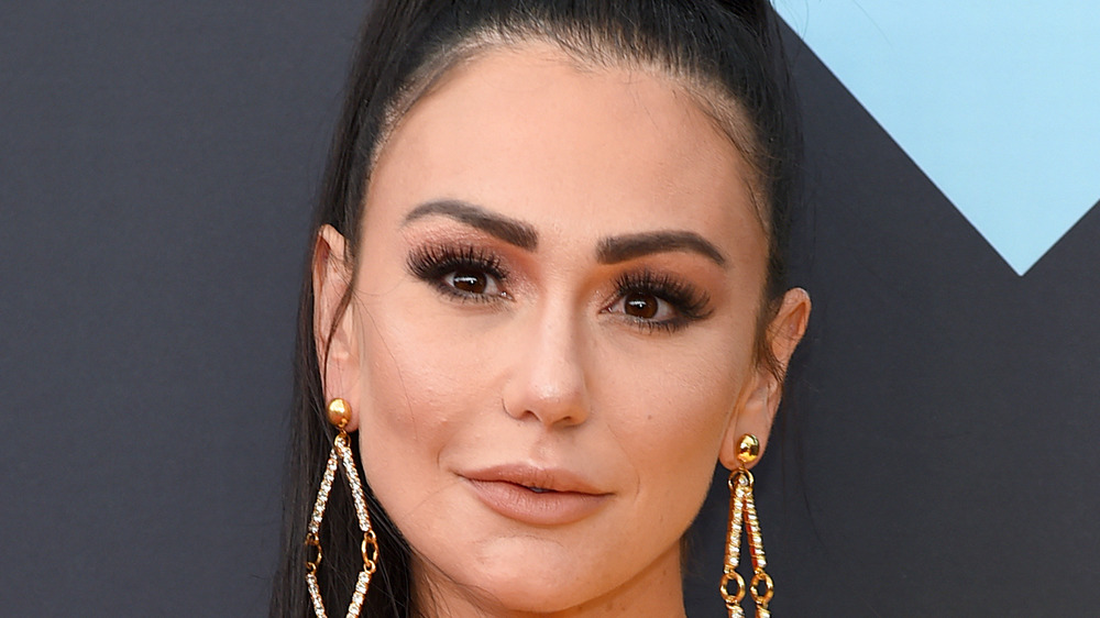 Jenni 'JWoww' Farley posing at a red carpet event