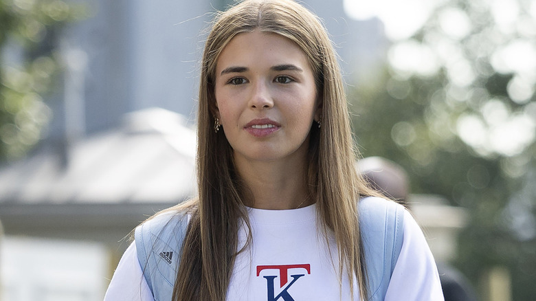 Kai Trump modeling a monogrammed sweatshirt