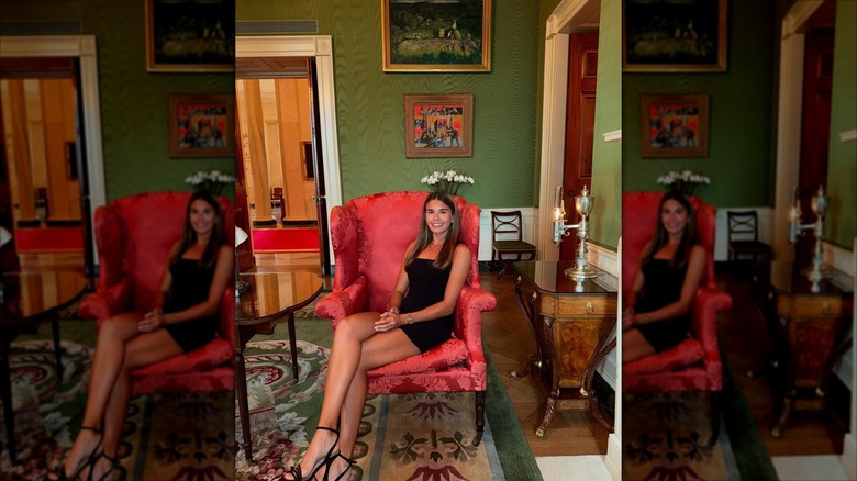 Kai Trump sits in a red chair