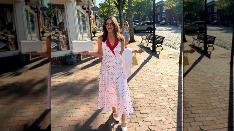 Kaitlan Collins smiling outside holding a bakery box.