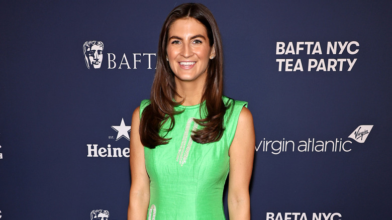 Kaitlan Collins in a green dress