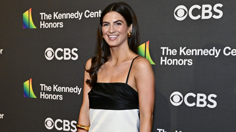 Kaitlan Collins in a black and white dress