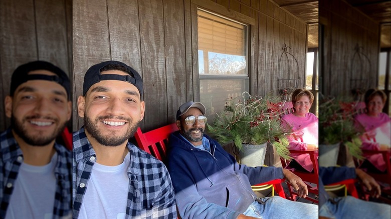 Will Douglas posing for a selfie with his father and mother