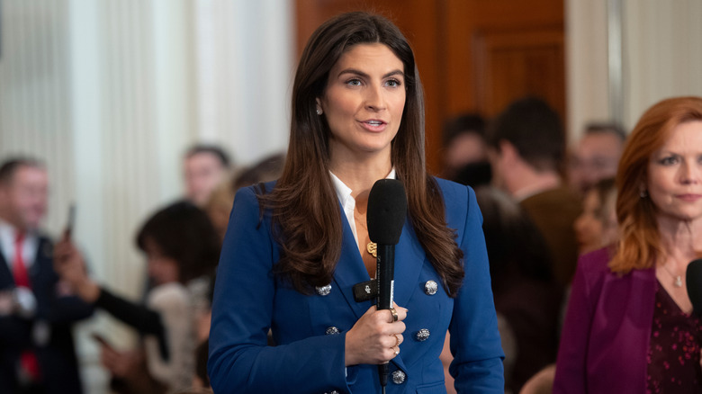 Kaitlan Collins talking into a microphone.