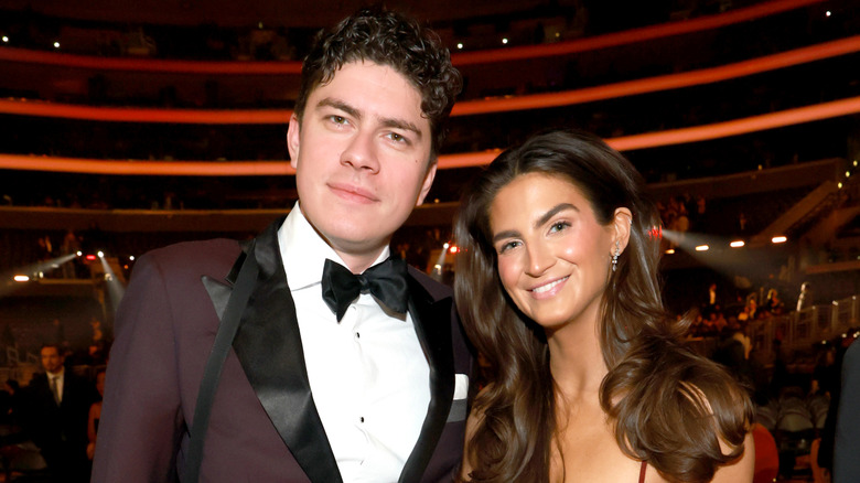 Kaitlan Collins posing with Emilio Madrid at the 2025 Grammys.