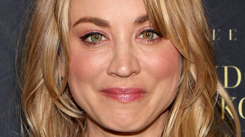 Kaley Cuoco smirking