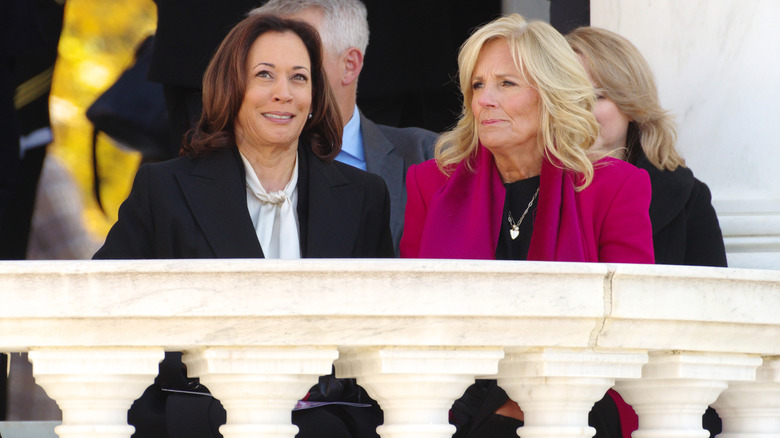 U.S. Vice President Kamala Harris sitting with First Lady Jill Biden at a Veterans Day ceremony at Arlington National Cemetery