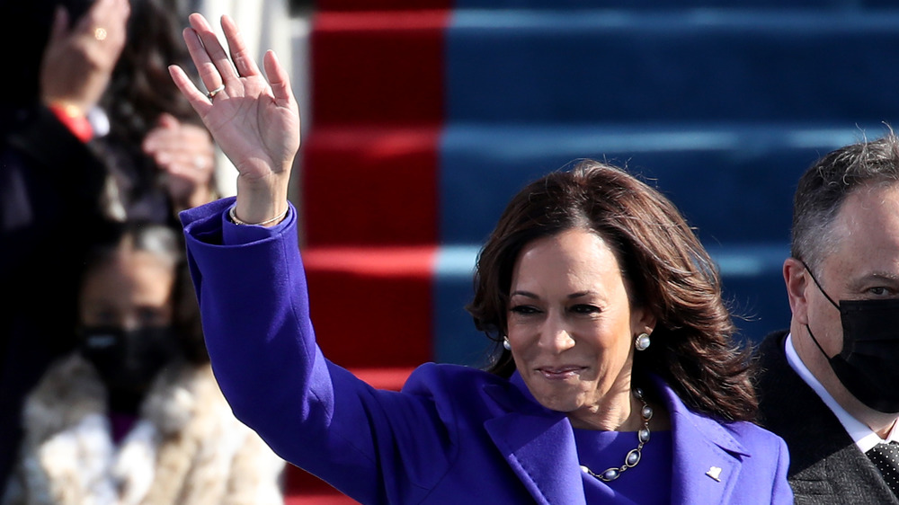 Kamala Harris waving at the inauguration crowd