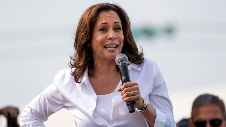 Kamala Harris holding microphone