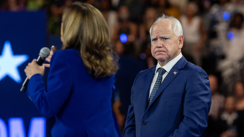 Tim Walz frowning at Kamala Harris