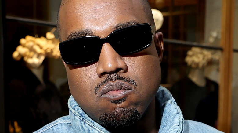 Kanye West posing for cameras 