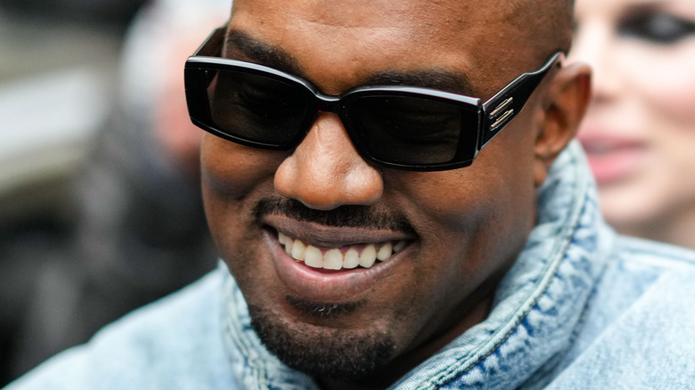 Ye smiling in sunglasses