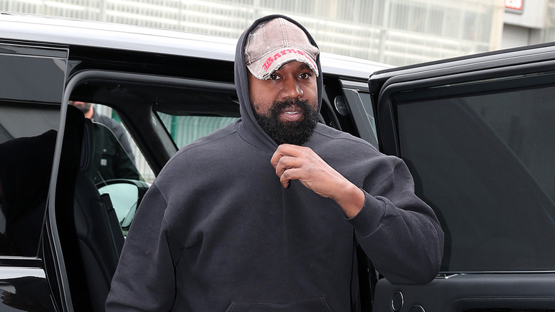 Kanye West exiting car