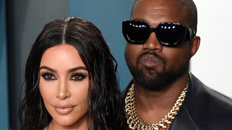 Kim Kardashian and Kanye West posing