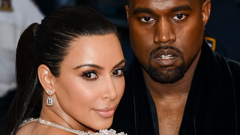 Kim Kardashian and Ye pose together on the red carpet