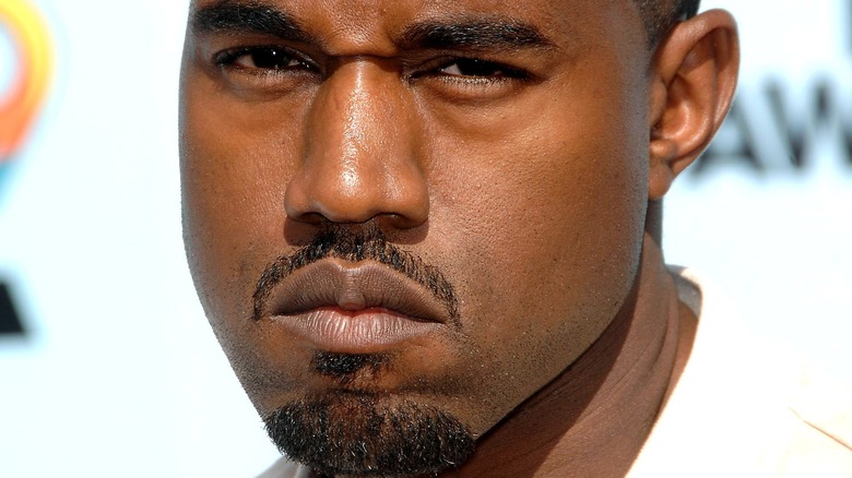 Kanye West frowning red carpet