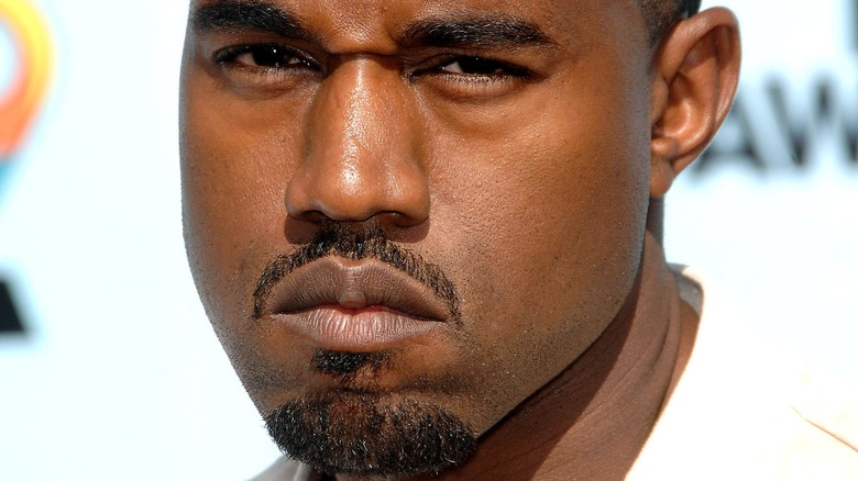 Kanye Ye West scowling