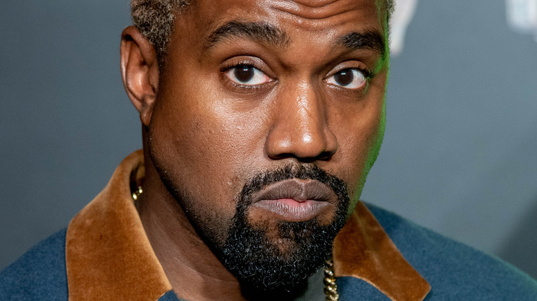 Ye posing with eyes open