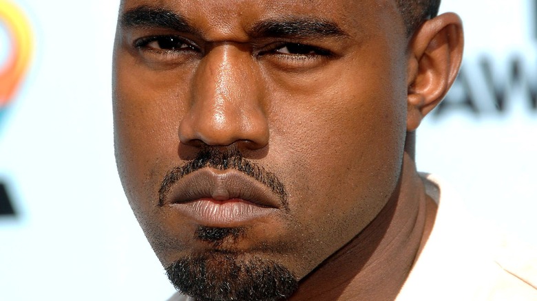 Kanye West scowling on red carpet
