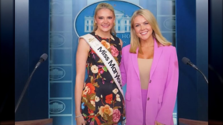 Karoline Leavitt wearing a pink blazer and posing next to Bridget O'Brien