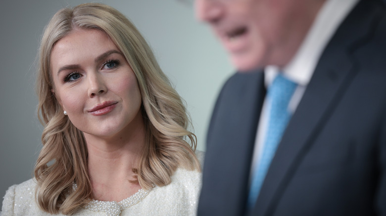 White House Press Secretary Karoline Leavitt listening as Director of the National Economic Council Kevin Hassett delivers remarks at a press briefing