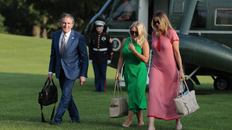 Karoline Leavitt and Margo Martin walking from Marine 1