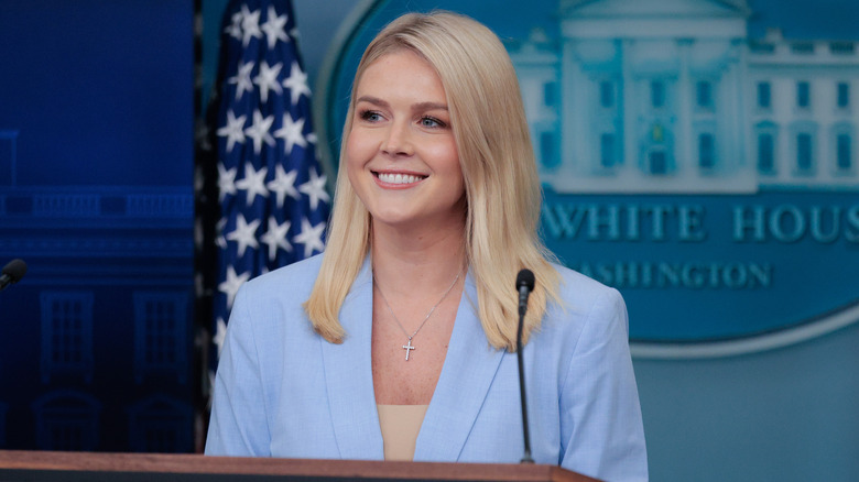 Karoline Leavitt smiling during press briefing at the White House