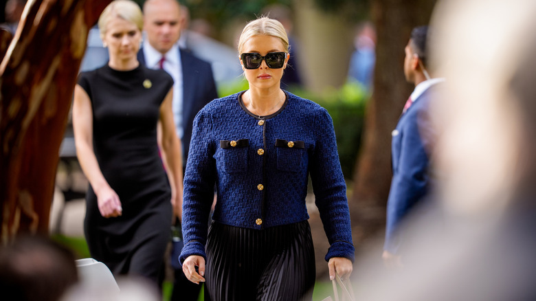 Karoline Leavitt dressed in a blue cardigan