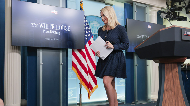 Karoline Leavitt in a navy blue dress