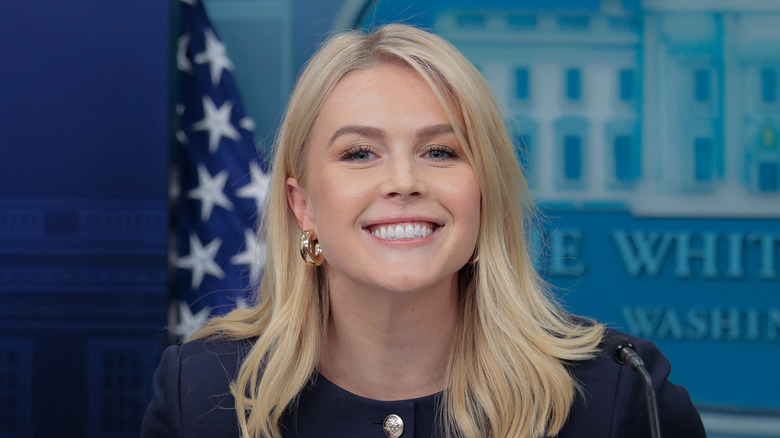 Karoline Leavitt smiles at a press conference