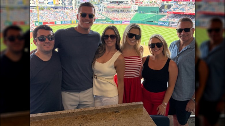 karoline Leavitt, Nicholas Riccio, Margo Martin and friends at a baseball game.