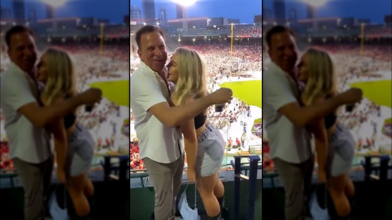 Karoline Leavitt and Nicholas Riccio cozying up at a baseball game.
