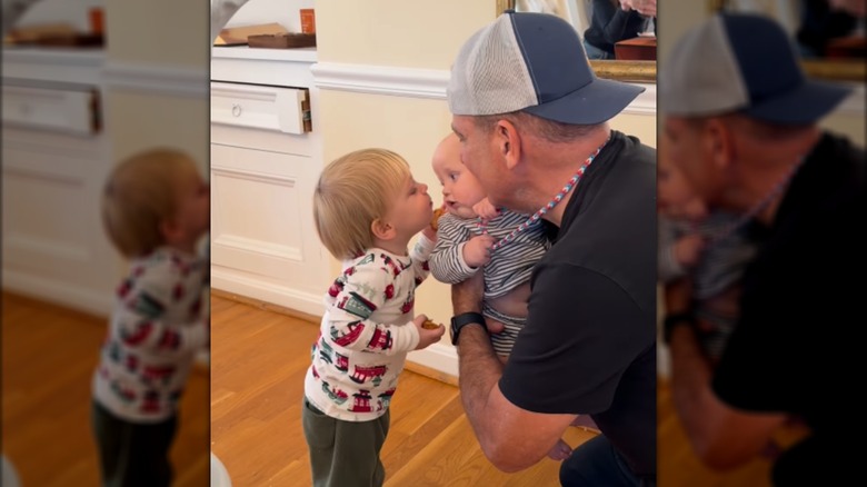 Nicholas Riccio introducing his son to another baby.