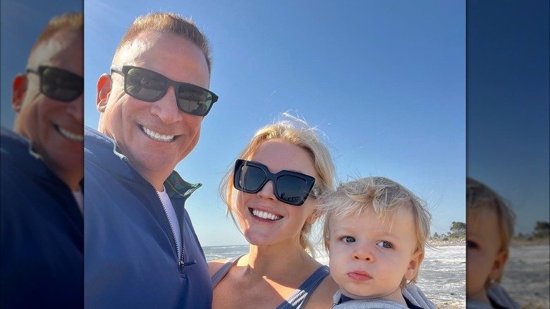 Nicholas Riccio and Karoline Leavitt smiling with their son, Niko Riccio