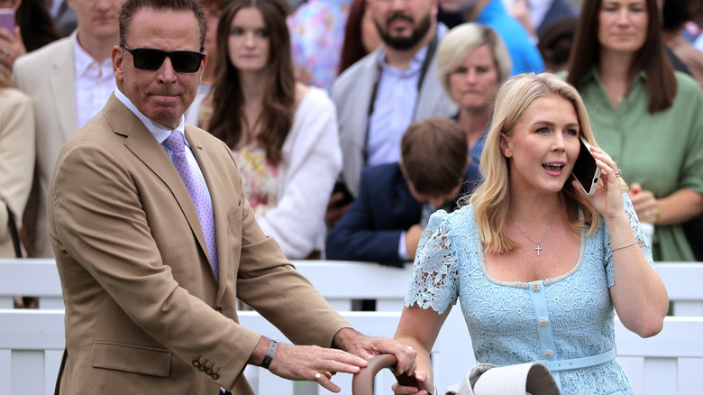 Karoline Leavitt standing with her husband and son