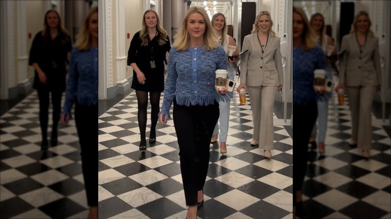 Karoline Leavitt and coworkers walking through the White House