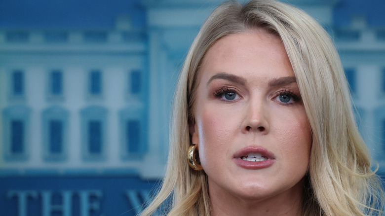 Close-up Karoline Leavitt with White House logo background