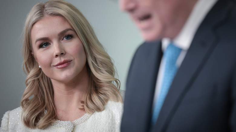 White House Press Secretary Karoline Leavitt listening as Director of the National Economic Council Kevin Hassett delivers remarks at a press briefing at the White House