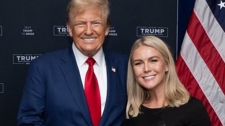 Donald Trump posing with Karoline Leavitt
