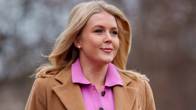 Karoline Leavitt walking outside the White House