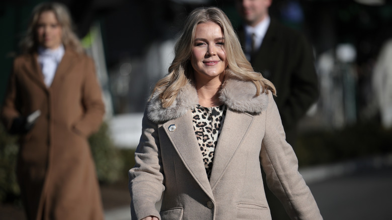 Karoline Leavitt walking outside the White House