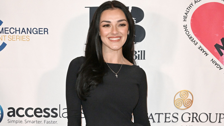 Alexis Wilkins posing on the red carpet.