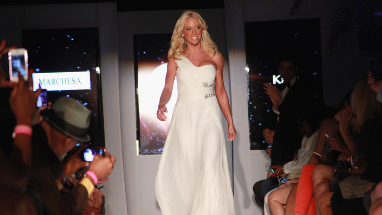 Kate Gosselin walking down runway, smiling