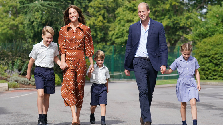Kate Middleton Prince William holding kids hands
