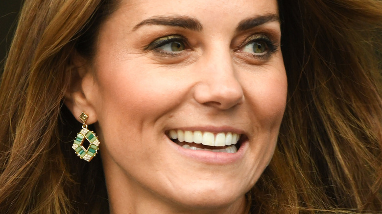 Kate Middleton smiles at a royal outing