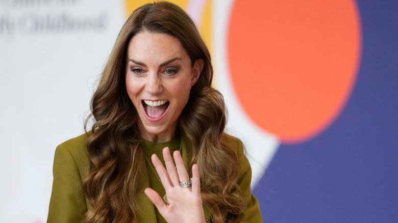 Kate Middleton smiling and waving