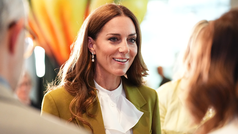 Kate Middleton speaks to people