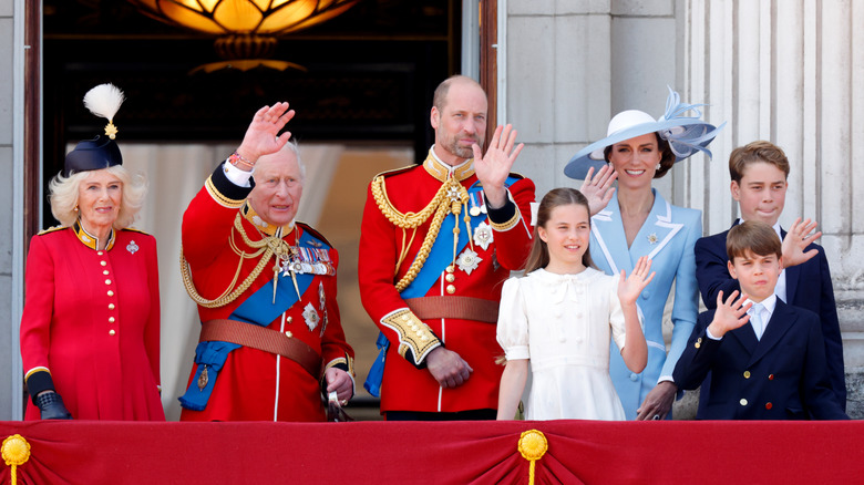 The royal family waving to the crowd.